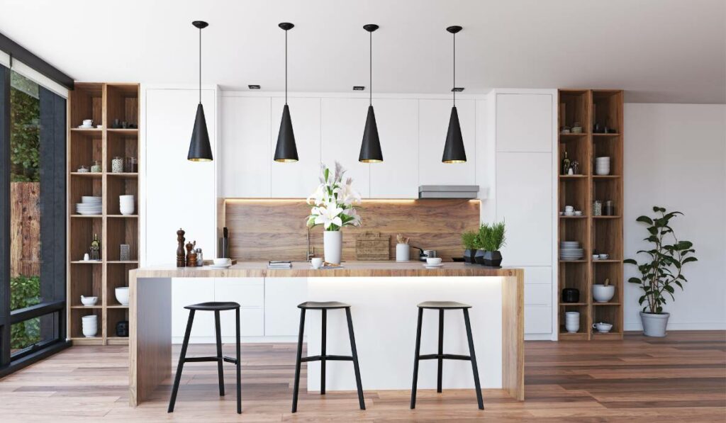 A beautifully staged modern kitchen with wooden floors and white cabinets