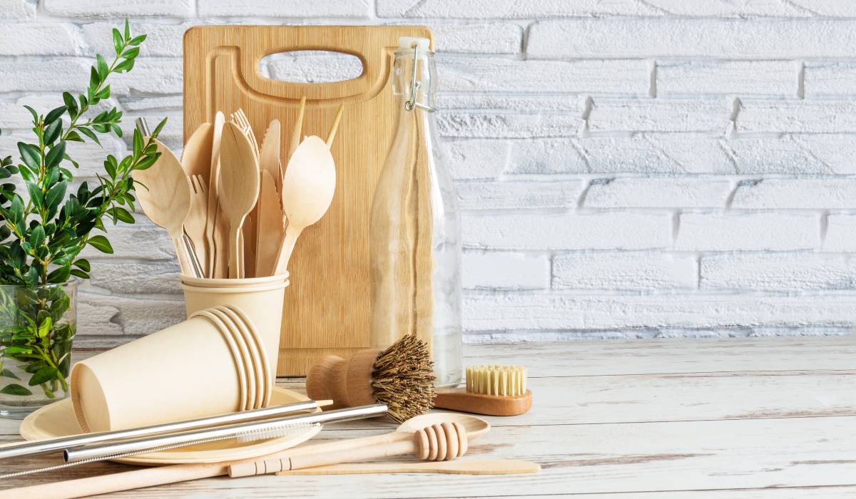 Eco friendly utensils are arranged on a wooden table