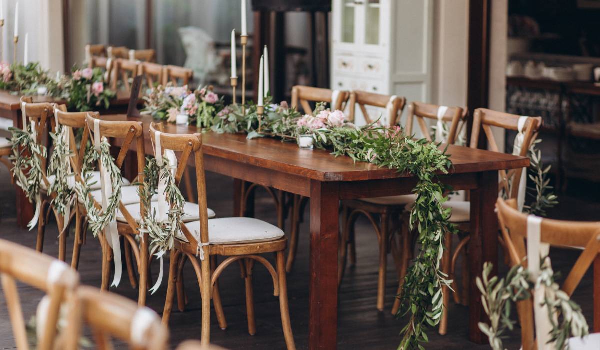a table and chairs setup with greens, side hustle