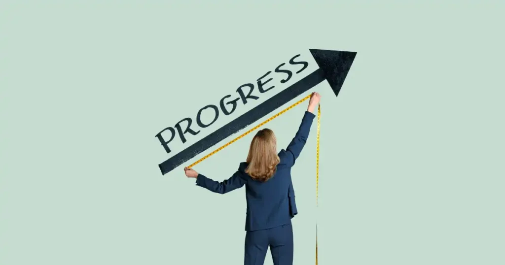 a woman wearing a suit is measuring an arrow with the word "progress" written on it using a measuring tape.