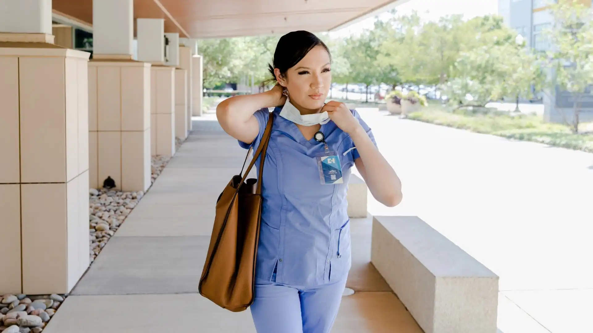 nurse walking down side walk